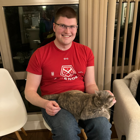 Stephen with Kulfi while wearing D.C. Defenders shirt