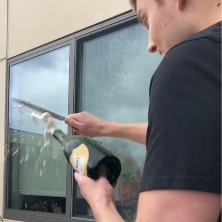 Stephen the second after sabering champagne bottle